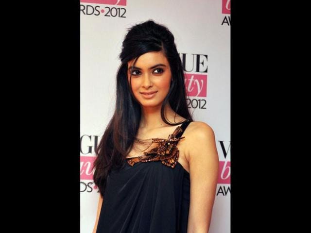 Cocktail-actress-Diana-Penty-looked-chic-in-a-black-outfit-The-bronze-butterfly-motif-adds-a-nice-touch