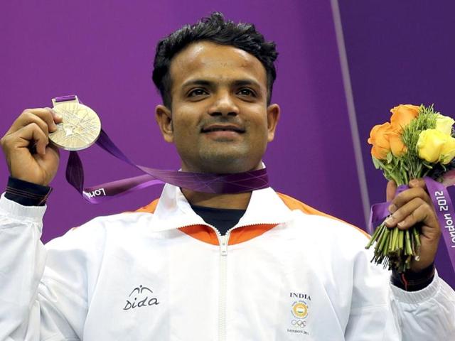 India's silver medal winner Vijay Kumar poses with his silver medal won in the men's 25m rapid fire pistol shooting event at the London 2012 Olympic Games at the Royal Artillery Barracks REUTERS/Sergio Moraes