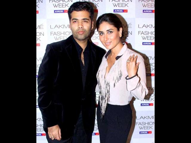 Kareena Kapoor is experimenting with her style a lot of late! The actress at her stylish best poses with director Karan Johar at the Lakme Fashion Week in Mumbai on August 3. (PTI Photo)