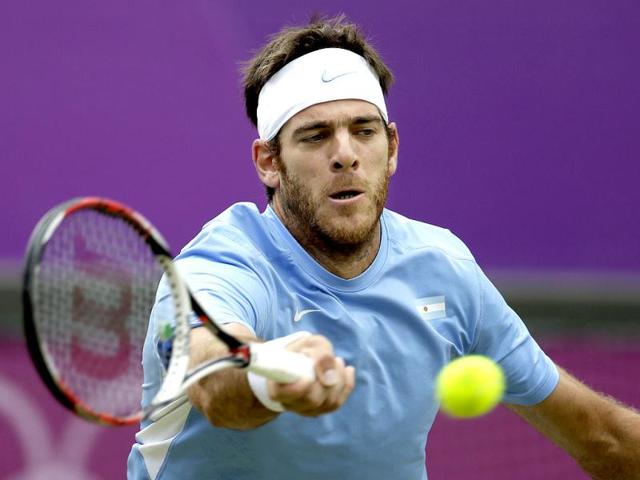 Juan-Martin-del-Potro-of-Argentina-returns-a-shot-to-Novak-Djokovic-of-Serbia-in-the-men-s-singles-bronze-medal-match-at-the-All-England-Lawn-Tennis-Club-at-Wimbledon-in-London-at-the-2012-Summer-Olympics-AP-Photo-Mark-Humphrey
