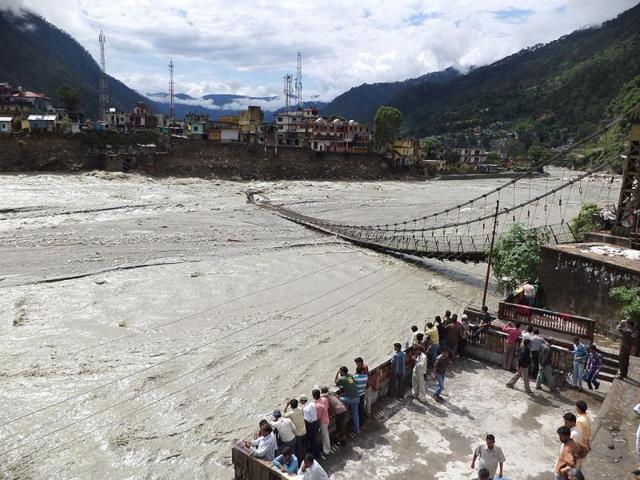 A suspension bridge is washed away in Uttarkashi district due to flooding. (HT Photo/Santosh Bhatt)