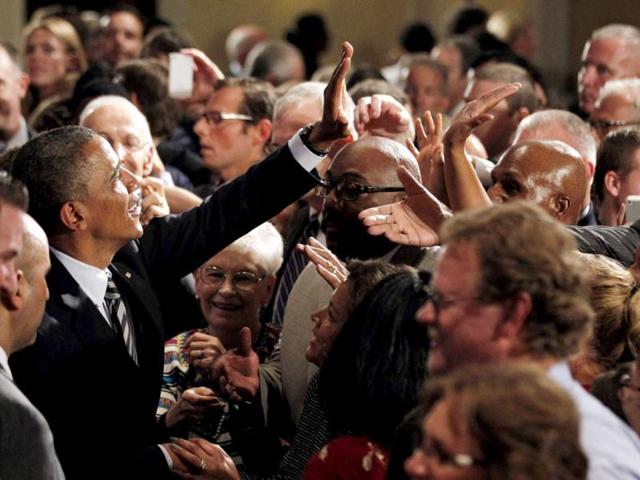 US President Barack Obama greets members of the audience after delivering remarks at an election campaign fundraiser in Stamford, Connecticut. Reuters/Jason Reed