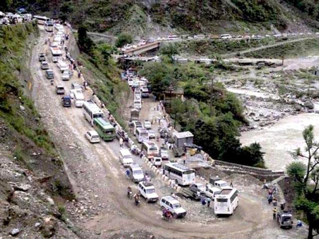 Vehicles stranded in mud on a highway after cloud burst and heavy rains in Uttarkashi. PTI Photo