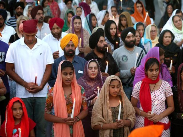 Guests attend an interdenominational candlelight vigil at the Illinois Sikh Community Center in Wheaton, Illinois. AFP/Scott Olson