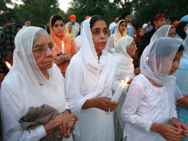 Guests attend an interdenominational candlelight vigil at the Illinois Sikh Community Center in Wheaton, Illinois. AFP/Scott Olson