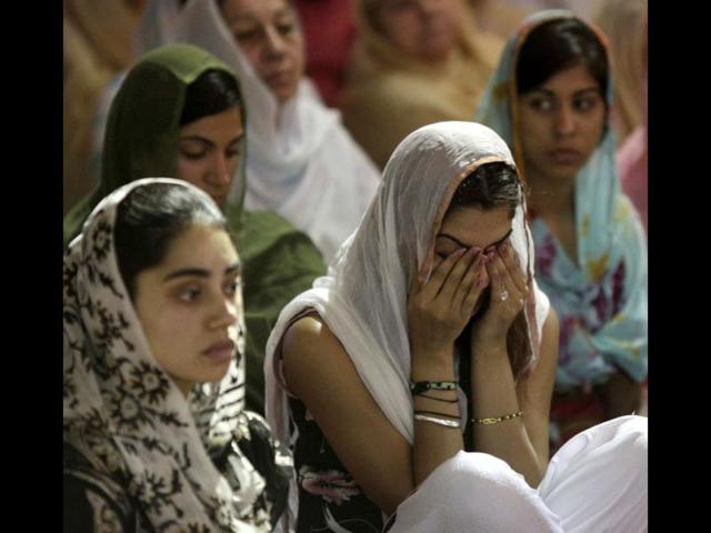Mourners attend a prayer service at the Sikh Temple in Brookfield, Wisconsin. Reuters/John Gress