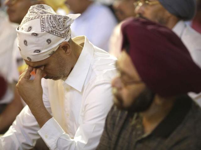 Mourners attend a prayer service at the Sikh Temple in Brookfield, Wisconsin. Reuters/John Gress