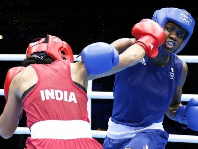 MC Mary Kom defends against Nicola Adams of Great Britain during the women's Flyweight boxing semi-finals of the 2012 London Olympic Games at the ExCel Arena. AFP/Jack Guez