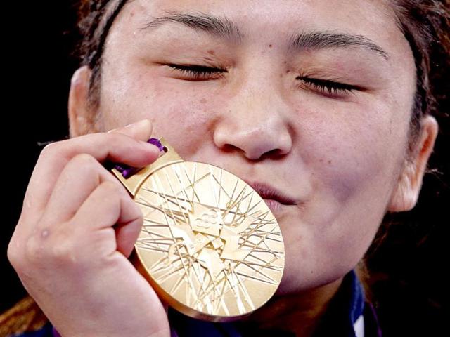 Japan's Kaori Icho kisses her gold medal at the podium of the Women's 63Kg Greco-Roman wrestling at the ExCel venue during the London 2012 Olympic Games. Reuters Photo