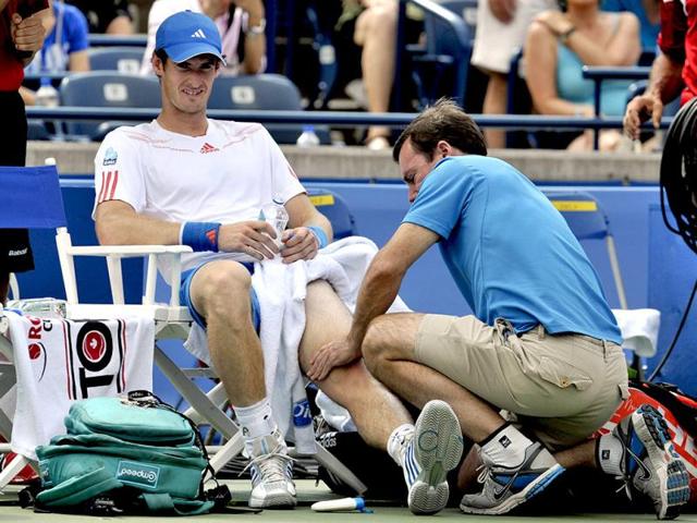 Andy Murray of Britain has his left knee worked on during a medical time-out in his match against Flavio Cipolla of Italy at the Toronto Masters tennis tournament in Toronto. Reuters Photo