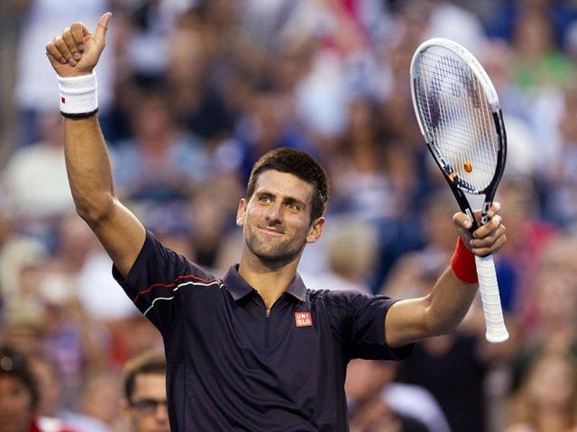 Serbia's Novak Djokovic celebrates after defeating Australia's Bernard Tomic 6-2, 6-3 during their match at the Rogers Cup men's tennis tournament in Toronto. AP Photo