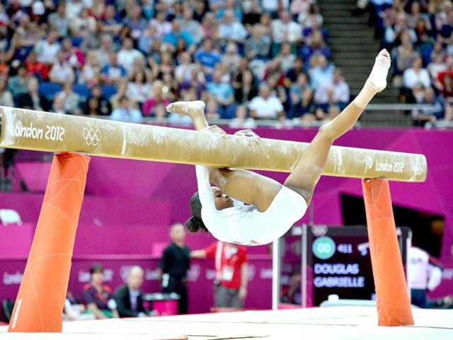 US Gabrielle Douglas falls off the beam during the women's beam competition of the artistic gymnastics event of the London Olympic Games at the 02 North Greenwich Arena in London. AFP/Ben Stansall