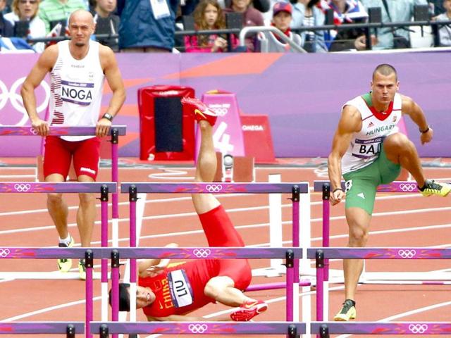 China's Liu Xiang falls while competing in his men's 110m hurdles round 1 heat during the London 2012 Olympic Games at the Olympic Stadium. Reuters/David Gray