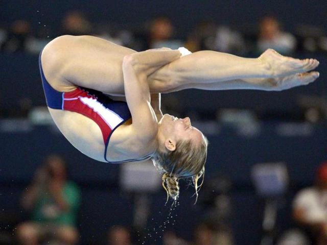 Brittany Viola of the United States dives during the women's 10-meter platform diving semifinal at the Aquatics Centre in the Olympic Park during the 2012 Summer Olympics in London. AP Photo/Mark J Terrill
