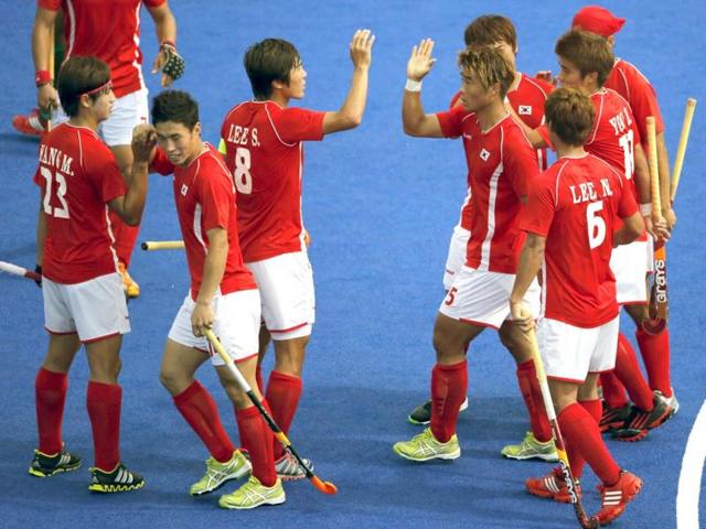 South Korea's Hye Sung-hyun , second left, celebrates scoring a goal against Pakistan with his teammates in their hockey classification match at the 2012 Summer Olympics, in London. AP Photo/Eranga Jayawardena