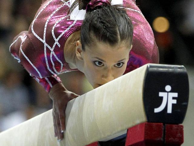 American gymnast Alicia Sacramone not only wows crowds with her drop-dead gorgeous looks, but also manages to score perfect 10s at the vault every time. Reuters/Jerry Lampen