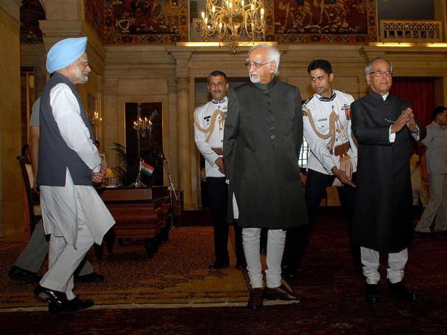 President Pranab Mukherjee and Vice President Mohmmed Hamid Ansari waiting for Prime Minister Manmohan Singh for a group photograph after the swearing in ceremony of Ansari for a second term, at Rashtrapati Bhavan in New Delhi. Agencies