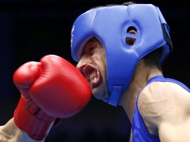 Nordine Oubaali of France (L) fights against Afghanistan's Ajmal Faisal in the men's Fly (52kg) Round of 32 boxing match at the ExCeL venue during the London 2012 Olympic Games. Reuters/Murad Sezer