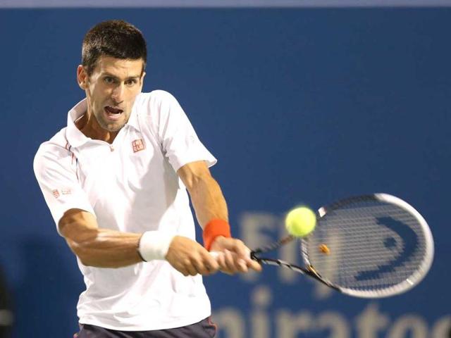Novak Djokovic of Serbia hits a return during his semi-final match against Janko Tipsarevic of Serbia during the Rogers Cup Presented By National Bank at Rexall Centre at York University in Toronto, Canada. AFP Photo