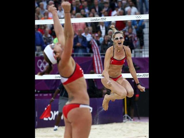 United States' Misty May-Treanor, left, and Kerri Walsh Jennings celebrate after defeating China in their semifinal women's beach volleyball match at the 2012 Summer Olympics, in London. (AP Photo/Petr David Josek)