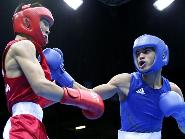 Tugstsogt-Nyambayar-of-Mongolia-in-red-defends-against-Robeisy-Ramirez-Carrazana-of-Cuba-in-blue-during-the-Flyweight-52kg-boxing-finals-of-the-2012-London-Olympic-Games-at-the-ExCel-Arena-in-London-AFP-Photo-Jack-Guez