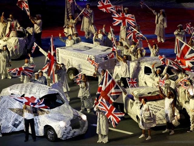 Performers wave Union Jack flags during the closing ceremony of the London 2012 Olympic Games at the Olympic Stadium. (Reuters/Fabrizio Bensch)