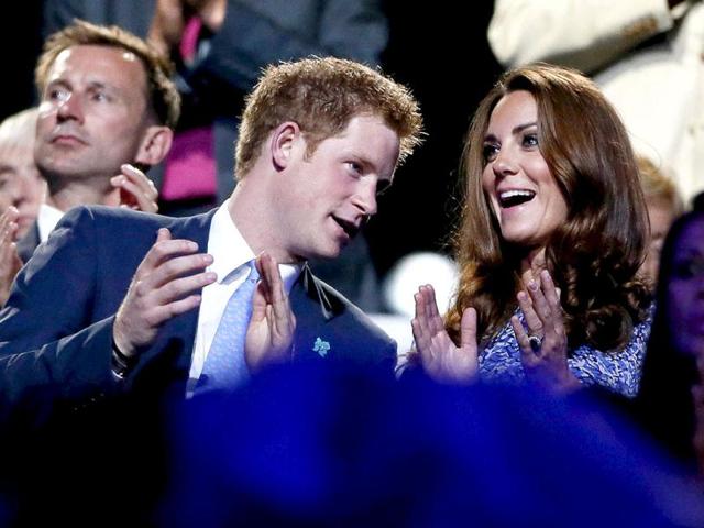 Britain's Prince Harry (L) and Dutchess of Cambridge Kate Middleton (R) applaud as they view the closing ceremony of the London 2012 Olympic Games at the Olympic Stadium. REUTERS