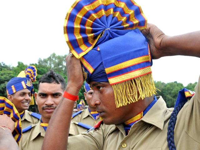 A CRPF jawan adjusting his haedgear during full dress rehearsal of the Independence Day Parade, at Morabadi Grounds in Ranchi. Agency