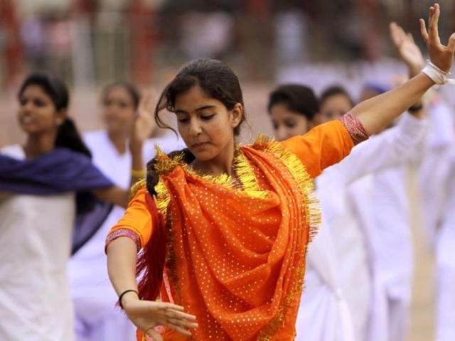 A young girl dances during the Independence Day celebration rehearsal in Jammu. AP photo/Channi Anand