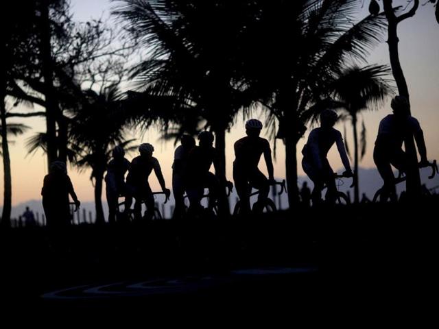 Cyclists ride in the seaside neighborhood of Ipanema in Rio de Janeiro. The world looks ahead to Rio de Janeiro and Brazil who will host the 2016 Olympic Games. (Reuters)