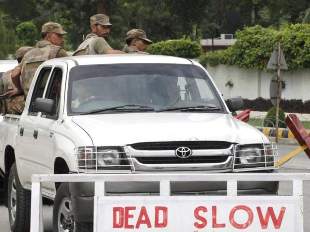 Pakistan army soldiers leave the Minhas base in the town of Kamra in Punjab province. Islamist militants armed with rocket-propelled grenades and automatic weapons fought their way into one of Pakistan's largest air bases, the air force said, in a brazen challenge to the nuclear-armed country's powerful military. REUTERS/Mian Khursheed