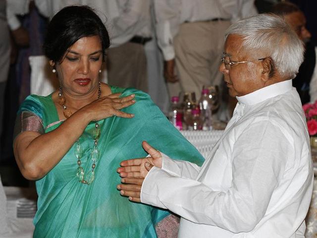 Lalu Prasad RJD chief with Shabana Azmi at an Iftar Party hosted by Prime Minister at his residence in New Delhi. (HT Photo/Arvind Yadav)