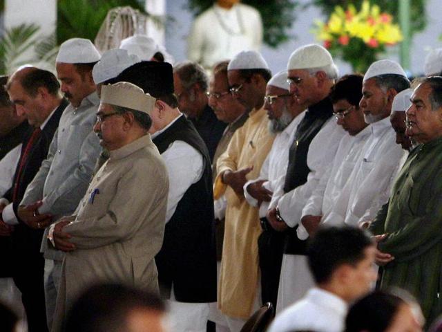 Muslims offering 'namaz' before breaking their fast during an Iftar Party hosted by Prime Minister Manmohan Singh at 7RCR in New Delhi. (PTI Photo/Vijay Verma)