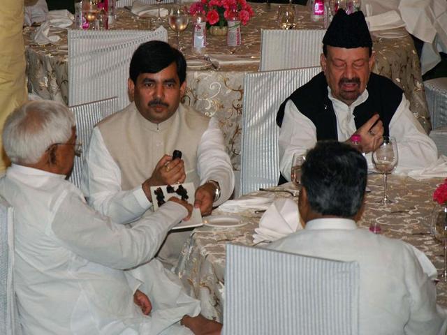 RJD president Laloo Prasad Yadav and senior BJP leader Syed Shahnawaz Hussain at an Iftar Party at an Iftar Party at Prime Minister's residence in New Delhi.
