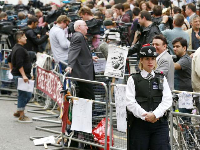 Police and media gather outside the Ecuador embassy in west London. Ecuador has granted political asylum to WikiLeaks' founder Julian Assangea day after the British government threatened to storm the Ecuadorean embassy in London to arrest the former hacker. (Reuters)