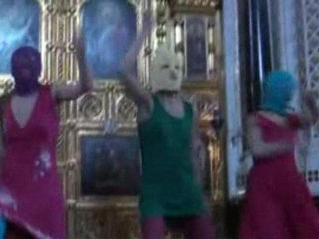 Members of the female punk band "Pussy Riot" stage a protest inside Christ The Saviour Cathedral in Moscow in this still image taken from file video. (Reuters)