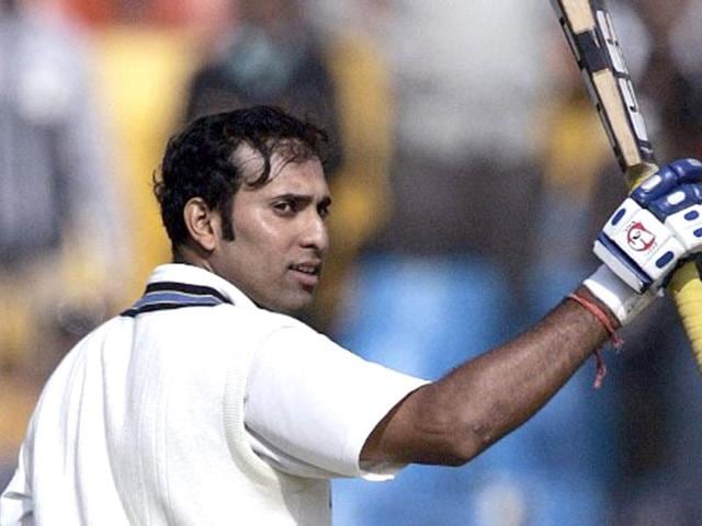 VVS Laxman raises his bat as he acknowledges the crowd's applause after he scored a century during the second day of the third and final Test match between India and Sri Lanka at the Sardar Patel Gujarat Stadium in Ahmedabad, 19 December 2005. AFP photo/Prakash Singh