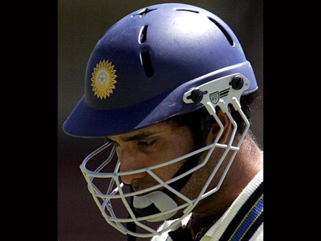A dejected VVS Laxman walks off the pitch after been run out by Zimbabwe's Tatenda Taibu for 144 runs during the third day of the first cricket Test, 15 September 2005 at Queens Sports club in Bulawayo. AFP photo/Alexander Joe