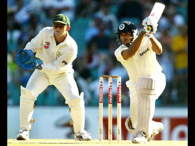 VVS Laxman (L) drives as Australian wicketkeeper Adam Gilchrist (L) looks on, on the first day of the fourth Test Match against India in Sydney 02 January 2004. AFP photo/William West
