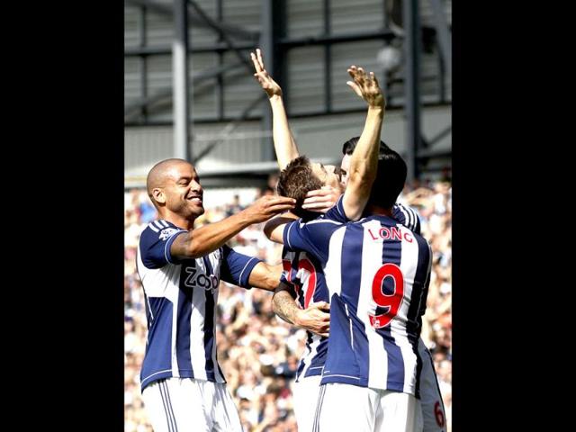 West Bromwich Albion's Zoltan Gera, center, celebrates his goal against Liverpool with teammates during their English Premier League soccer match at the Hawthorns, West Bromwich, England. (AP Photo)
