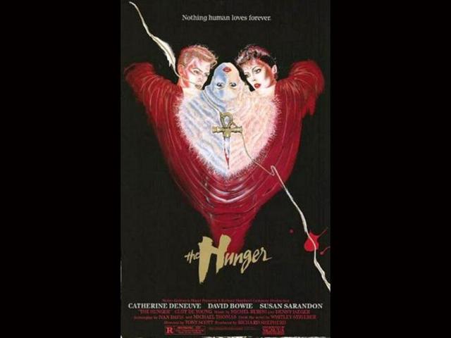 This horror film, released in 1983, marked the directorial debut of Tony Scott. It is the story of a love triangle between a doctor, played by Susan Sarandon who specializes in sleep and aging research and a vampire couple, played by Catherine Deneuve and David Bowie.