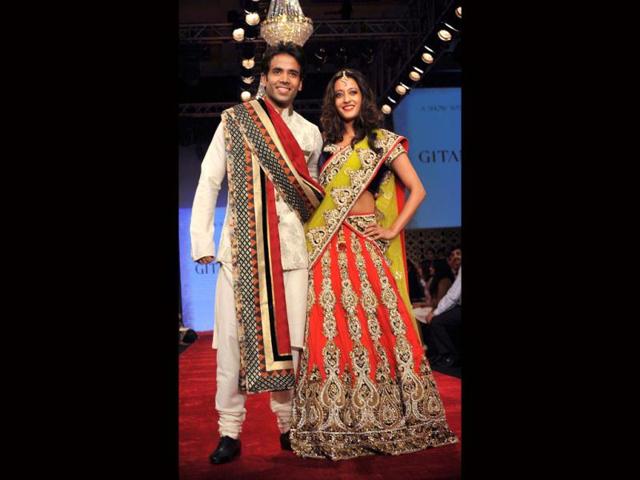 Tusshar Kapoor and Raima Sen walk the ramp for Gitanjali's BETI Foundation on the first day of IIJW 2012. (Photo: AFP) Tusshar Kapoor and Raima Sen walk the ramp for Gitanjali's BETI Foundation on the first day of IIJW 2012. (Photo: AFP)