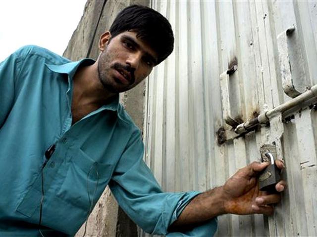 Mukhtar-Khan-neighbour-of-a-Christian-girl-arrested-for-alleged-blasphemy-shows-the-locked-house-of-a-girl-and-vowed-will-never-allow-them-to-live-in-this-neighborhood-in-a-suburb-of-Islamabad-AP-Photo-BK-Bangash Mukhtar-Khan-neighbour-of-a-Christian-girl-arrested-for-alleged-blasphemy-shows-the-locked-house-of-a-girl-and-vowed-will-never-allow-them-to-live-in-this-neighborhood-in-a-suburb-of-Islamabad-AP-Photo-BK-Bangash