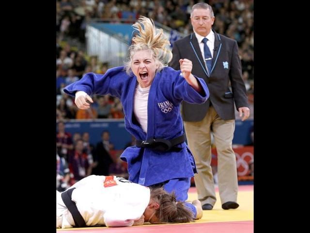 France's Automne Pavia celebrates after defeating Hungary's Hedvig Karakas in their women's -57kg bronze medal B judo match at the London 2012 Olympic Games. Reuters Photo France's Automne Pavia celebrates after defeating Hungary's Hedvig Karakas in their women's -57kg bronze medal B judo match at the London 2012 Olympic Games. Reuters Photo