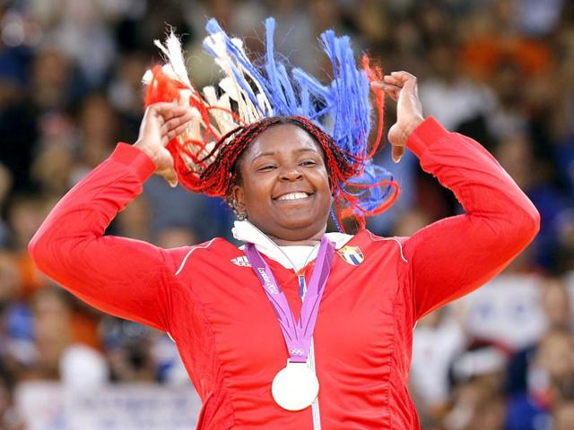 Gold medallist Cuba's Idalys Ortiz jumps at the victory ceremony for the women's +78kg judo event at the London 2012 Olympic Games. Reuters Photo Gold medallist Cuba's Idalys Ortiz jumps at the victory ceremony for the women's +78kg judo event at the London 2012 Olympic Games. Reuters Photo