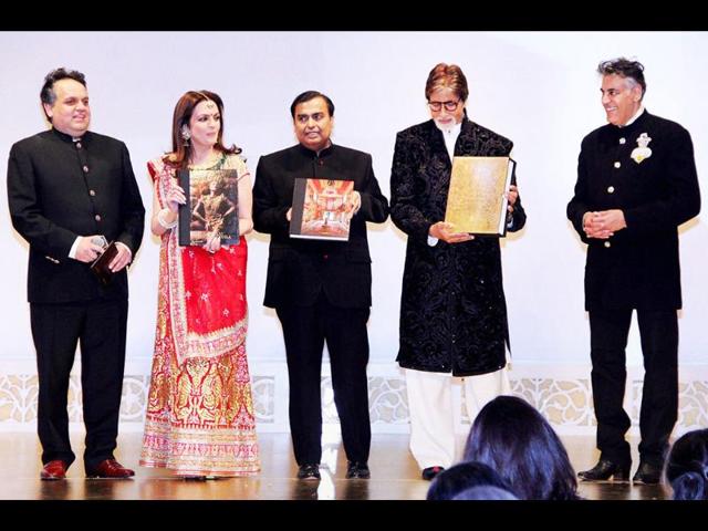Amitabh Bachchan, industrialist Mukesh Ambani and his wife Nita Ambani unveil Abu Jani and Sandeep Khosla's book at the event. (PTI Photo)