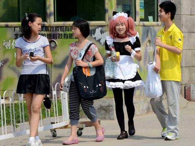 'Cosplay' fans leave the four-day 2012 Animation and Comics Fair at the National Agricultural Exhibition Center in Beijing. AFP/Mark Ralston