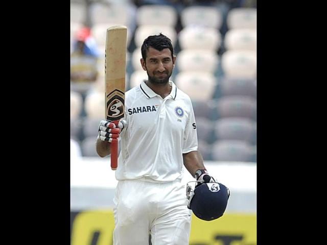 Cheteshwar-Pujara-raises-his-bat-after-scoring-150-runs-during-the-second-day-of-the-first-Test-match-between-India-and-New-Zealand-at-the-Rajiv-Gandhi-International-cricket-stadium-in-Hyderabad-AFP-Noah-Seelam Cheteshwar-Pujara-raises-his-bat-after-scoring-150-runs-during-the-second-day-of-the-first-Test-match-between-India-and-New-Zealand-at-the-Rajiv-Gandhi-International-cricket-stadium-in-Hyderabad-AFP-Noah-Seelam