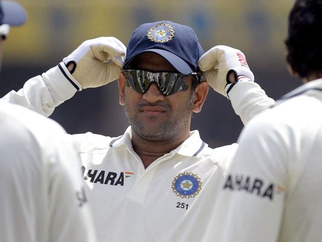 Indian-cricket-team-captain-Mahendra-Singh-Dhoni-gestures-as-the-third-day-of-the-first-Test-match-between-India-and-New-Zealand-is-delayed-due-to-rain-at-the-Rajiv-Gandhi-International-Cricket-Stadium-in-Hyderabad-AFP-Photo-Noah-Seelam-