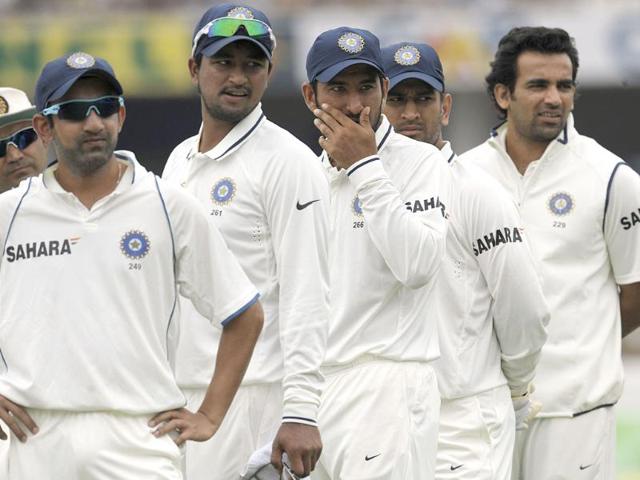 Gautam Gambhir, Pagnayan Ojha, Cheteshwar Pujara, captain Mahender Singh Dhoni and Zaheer Khan look on prior to start of the fourth day of the first Test match between India and New Zealand at the Rajiv Gandhi International cricket stadium in Hyderabad. AFP/Noah Seelam